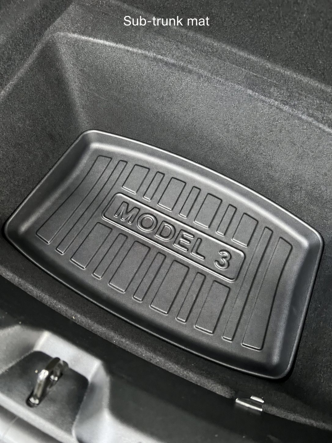 Sub-trunk mat installed beneath the cargo floor in a Highland Model 3
